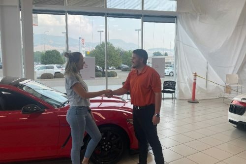 Photo of contest winner Adeena Johansen holding cheque